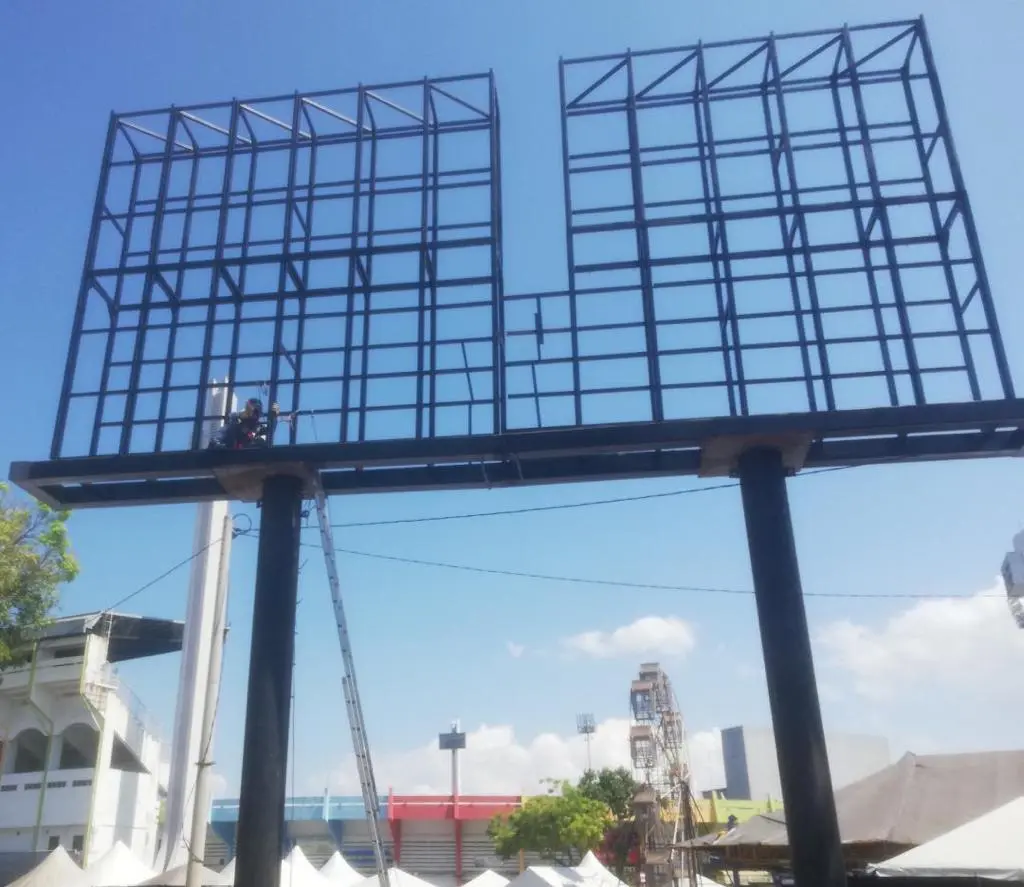 Steel support frame for an outdoor LED billboard during assembly in Malaysia