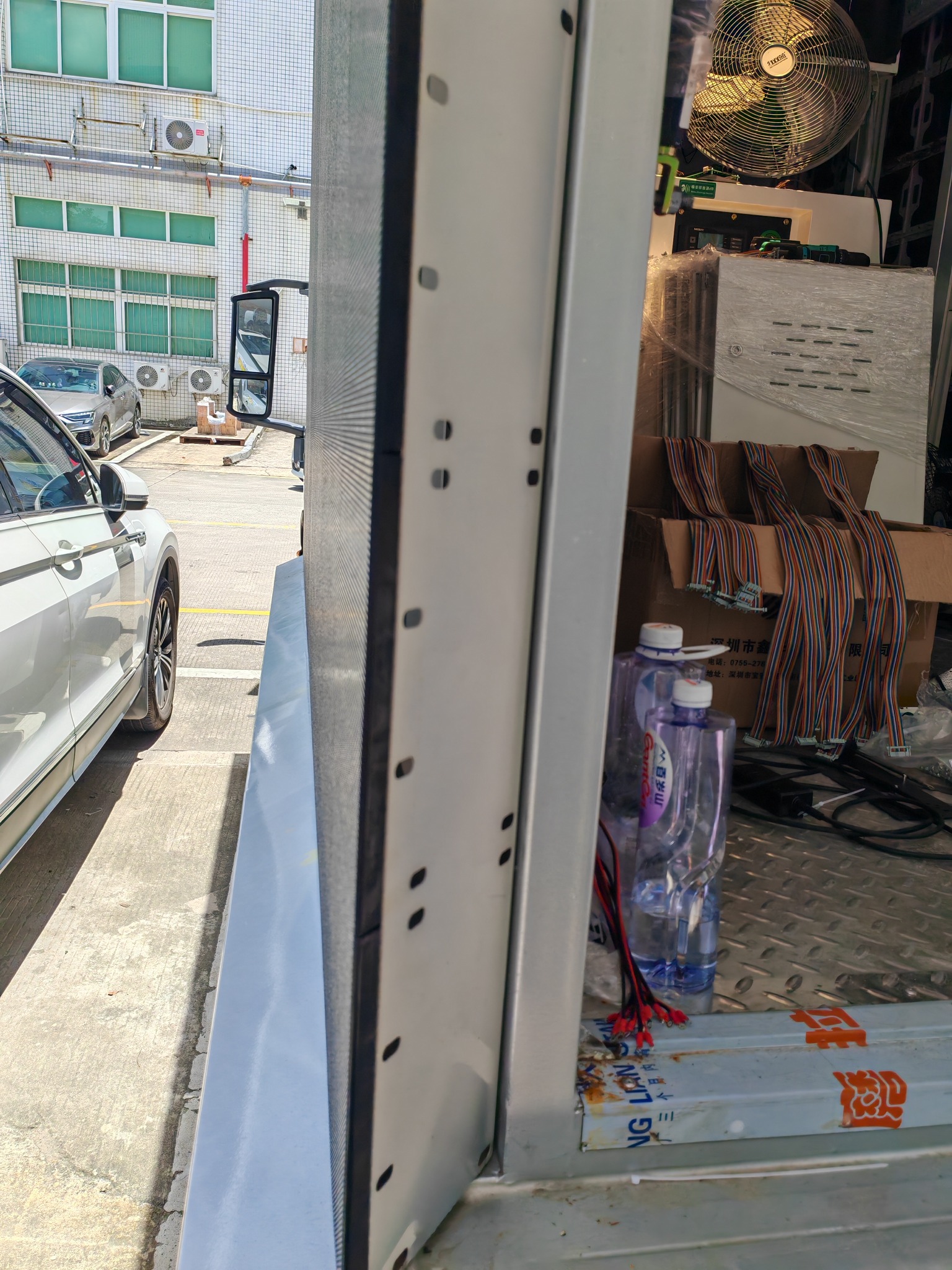 Close-up of the beveled rear edge beside the LED display on a mobile advertising truck